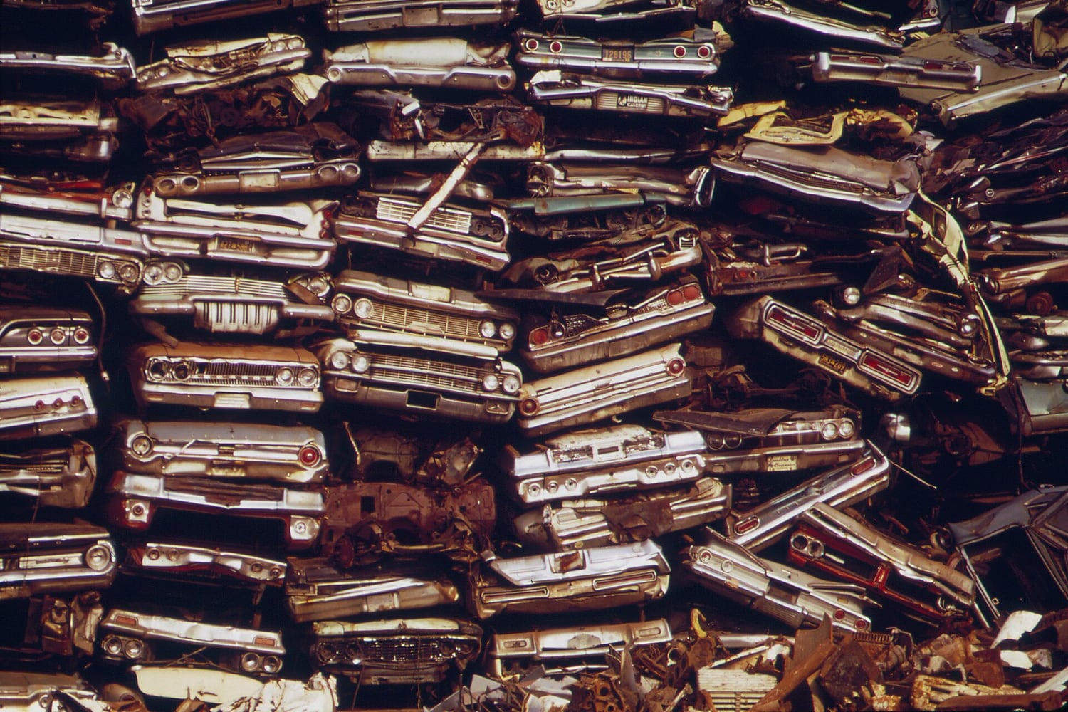 Crushed cars stacked high for scrap